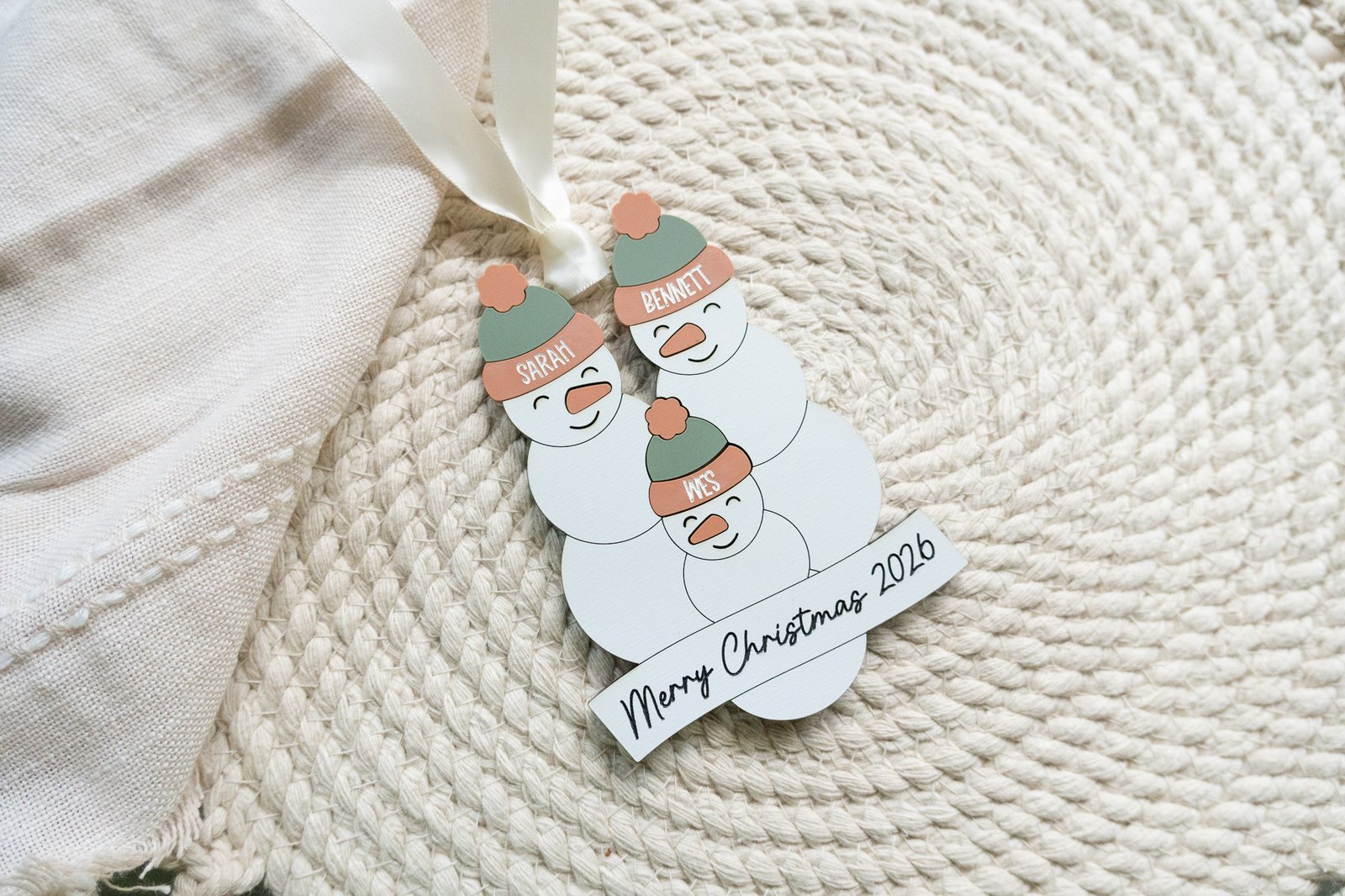 Personalized layered snowman family Christmas ornament with children's names and family name