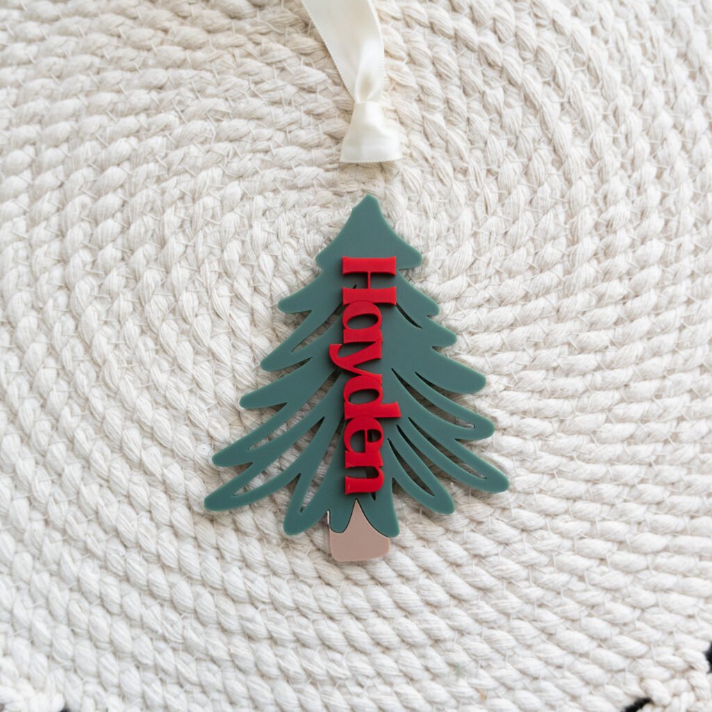 Personalized layered Christmas tree ornament with vertical red acrylic name